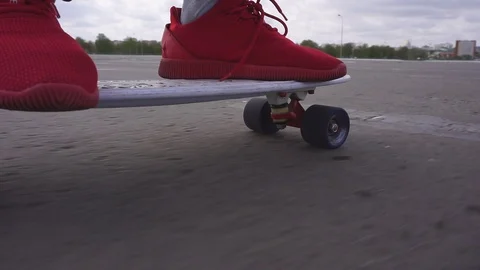 The guy on the longboard rides. Stock Footage 108059260
