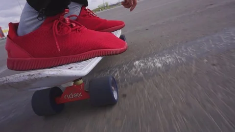 The guy on the longboard rides. Stock Footage 108059266