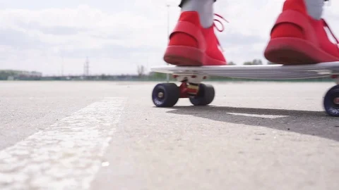 The guy on the longboard rides. Stock Footage 108059272
