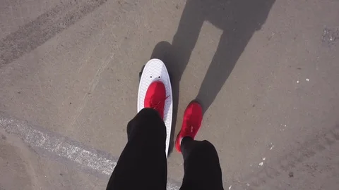 The guy on the longboard rides. Video stock 108059317