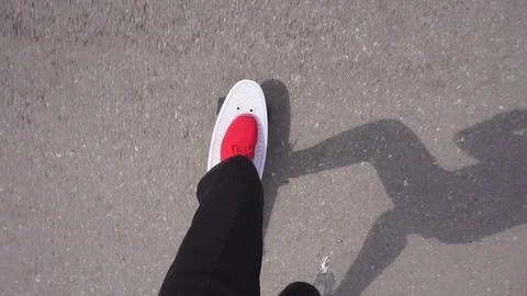 The guy on the longboard rides. Stock Footage 108059328