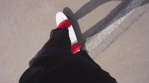 The guy on the longboard rides. Stock Footage 108059334