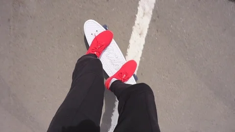 The guy on the longboard rides. Stock Footage 108059342