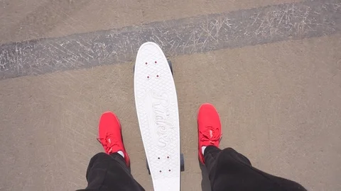 The guy on the longboard rides. Stock Footage 108059356