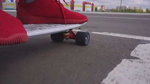 The guy on the longboard rides. Stock Footage 108059372