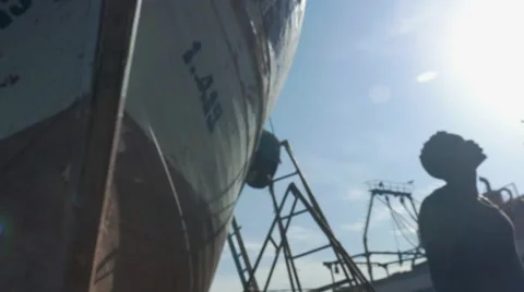 Guy looking around at the harbor 05 Stock Footage 67532370