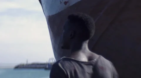 Guy looking around at the harbor Stock Footage 67522026