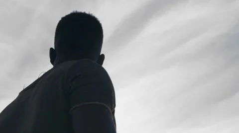 Guy looking at the birds in the sky 08 Stock Footage 67556368