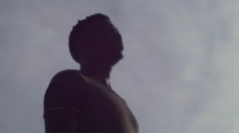 Guy looking at the birds in the sky 10 Stock Footage 67522755