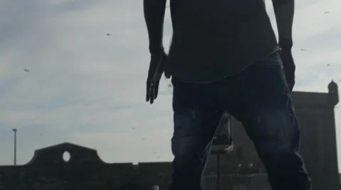 Guy looking at the birds in the sky 12 Stock Footage 67556101
