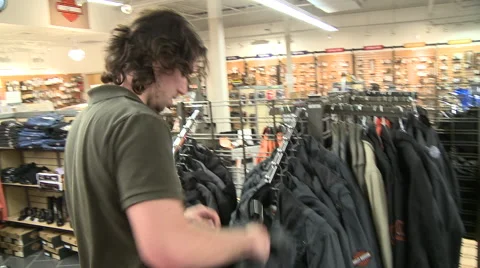 Guy Looking at Harley Jacket Stock Footage 45496797