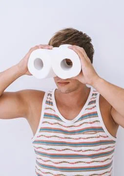 Guy is looking into improvised binoculars Stock Photos