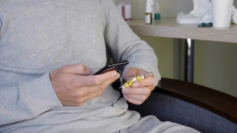 Guy looking for information of pills in search engine on smartphone Stock Footage 116031788
