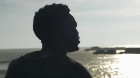 Guy looking at the seashore Video stock 67556360