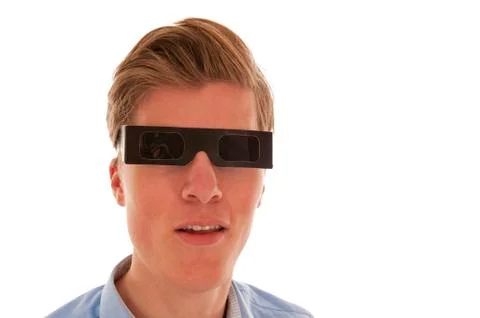 Guy looking through eclipse glasses Stock Photos