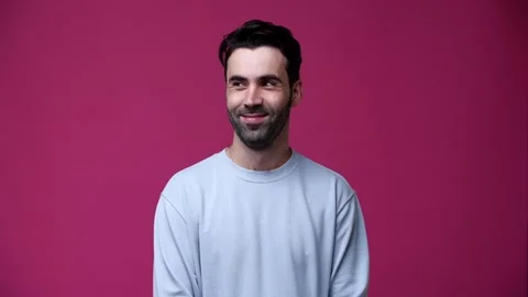 The guy looks around and shows quietly Stock Footage 162841817