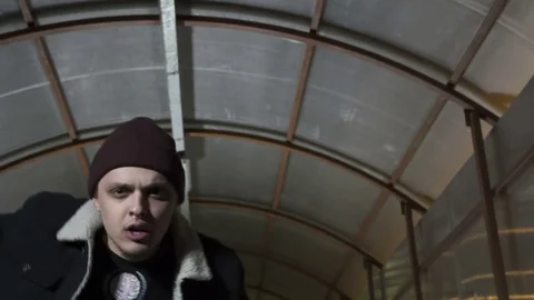 Guy looks into the camera and moves the body Stock Footage 80478311