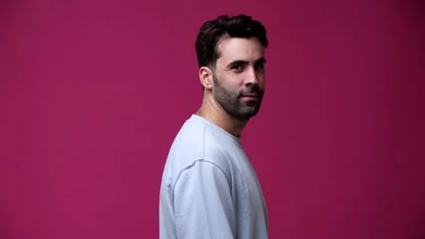 The guy looks at the camera and shows like, smiles Stock Footage 162841607