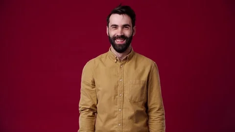 The guy looks at the camera and smiles Stock Footage 165620388