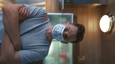 The guy looks at the camera at home in the kitchen Stock Footage 151534825