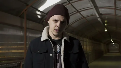 Guy looks into the camera with a serious face Stock Footage 80480490