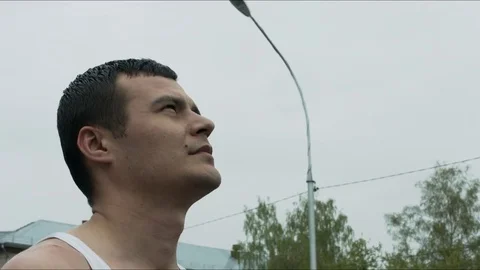 The guy looks at the sky Stock Footage 76071166