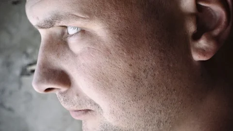 The guy looks thoughtfully somewhere in his garage Stock Footage 95998185
