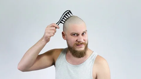 The guy lost his hair crying trying rascists. Baldness of the head Stock Footage 122005553