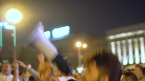 Guy loudspeaker goes into crowd, jumps and rejoices with crowd victory of Russia Stock Footage 96484820
