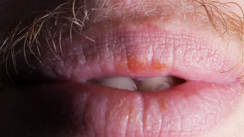 The guy lustfully licks his lips, an abomination, the lower part of the face  Stock-Footage 129093816