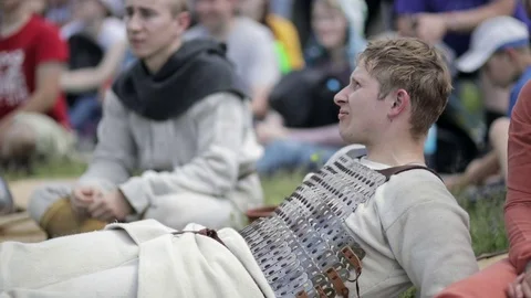 Guy is lying on the grass and waiting Stock Footage 82347583