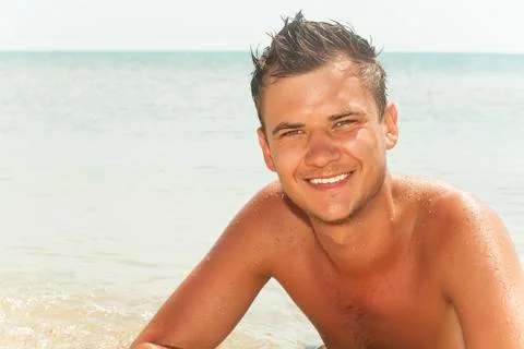 Guy lying in the water Stock Photos