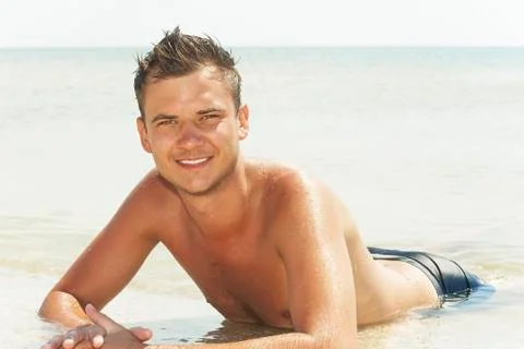 Guy lying in the water Stock Photos