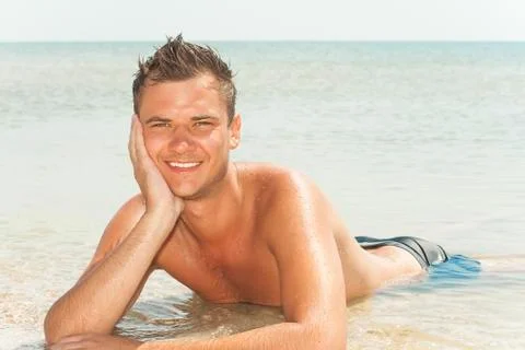 Guy lying in the water Stock Photos