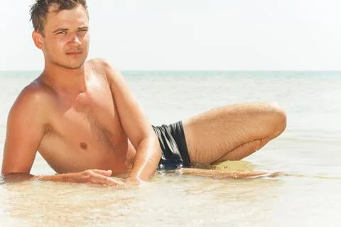 Guy lying in the water Stock Photos