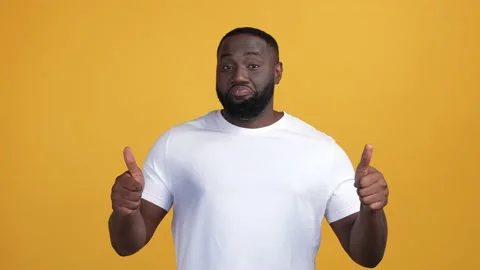 Guy make thumb-up symbol offer promo isolated bright color background Stock Footage 168890675