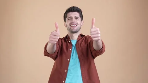 Guy make thumb up symbol offer excellent ads isolated pastel color background Stock Footage 169937796