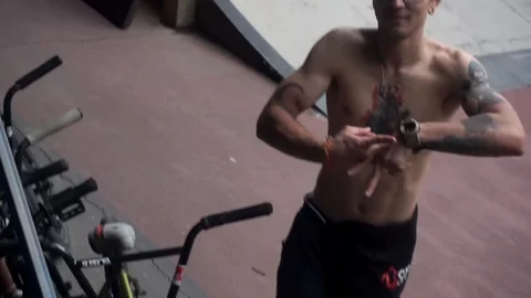 Guy makes gestures with his hands and climbs the stands Stock-Footage 103221831