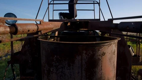 The guy makes triceps on parallel rails on a metal, rusty structure Stock Footage 79458560