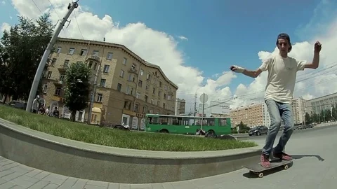 Guy makes a trick on a skateboard in the street Stock Footage 71364751