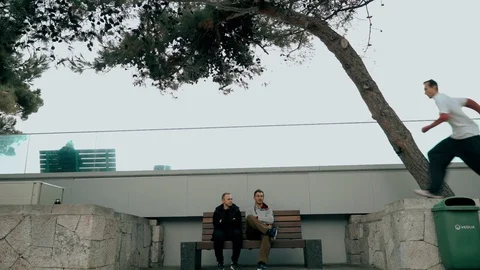 The guy makes a very long jump from the railing to the railing. The other two Stock Footage 120423120