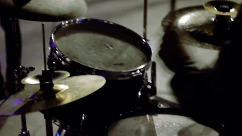 The guy man plays drums in the city's night park. Shock closeup.Beautiful glare Video stock 73488990