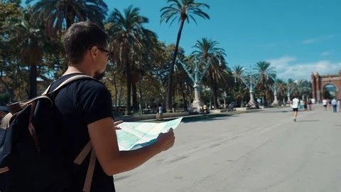Guy with a map in a park. Stock Footage 104723743