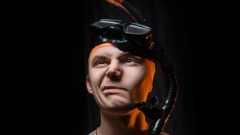 Guy in a mask for diving squirming face Stock Footage 87498198