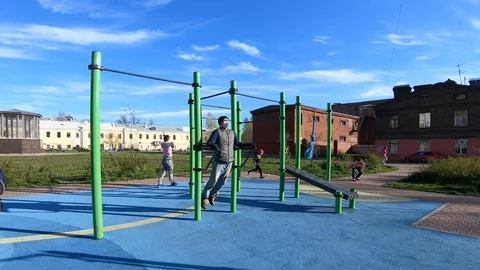 The guy in the mask is engaged on a horizontal bar Stock Footage 130116832