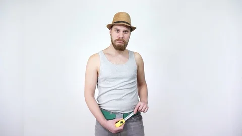 Guy measures line of your cucumber. Big size men's happiness. Stock Footage 129403494