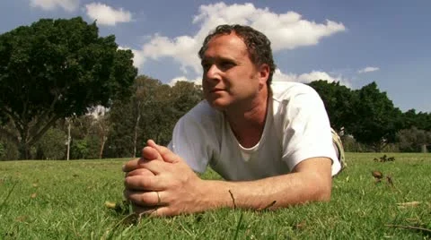 Guy meditating at the park Stock Footage 20510215