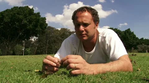Guy meditating at the park Stock Footage 20510315