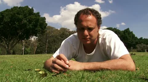 Guy meditating at the park Stock Footage 20510324