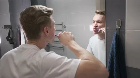 The guy at the mirror. Brush teeth. Stock Footage 150989607